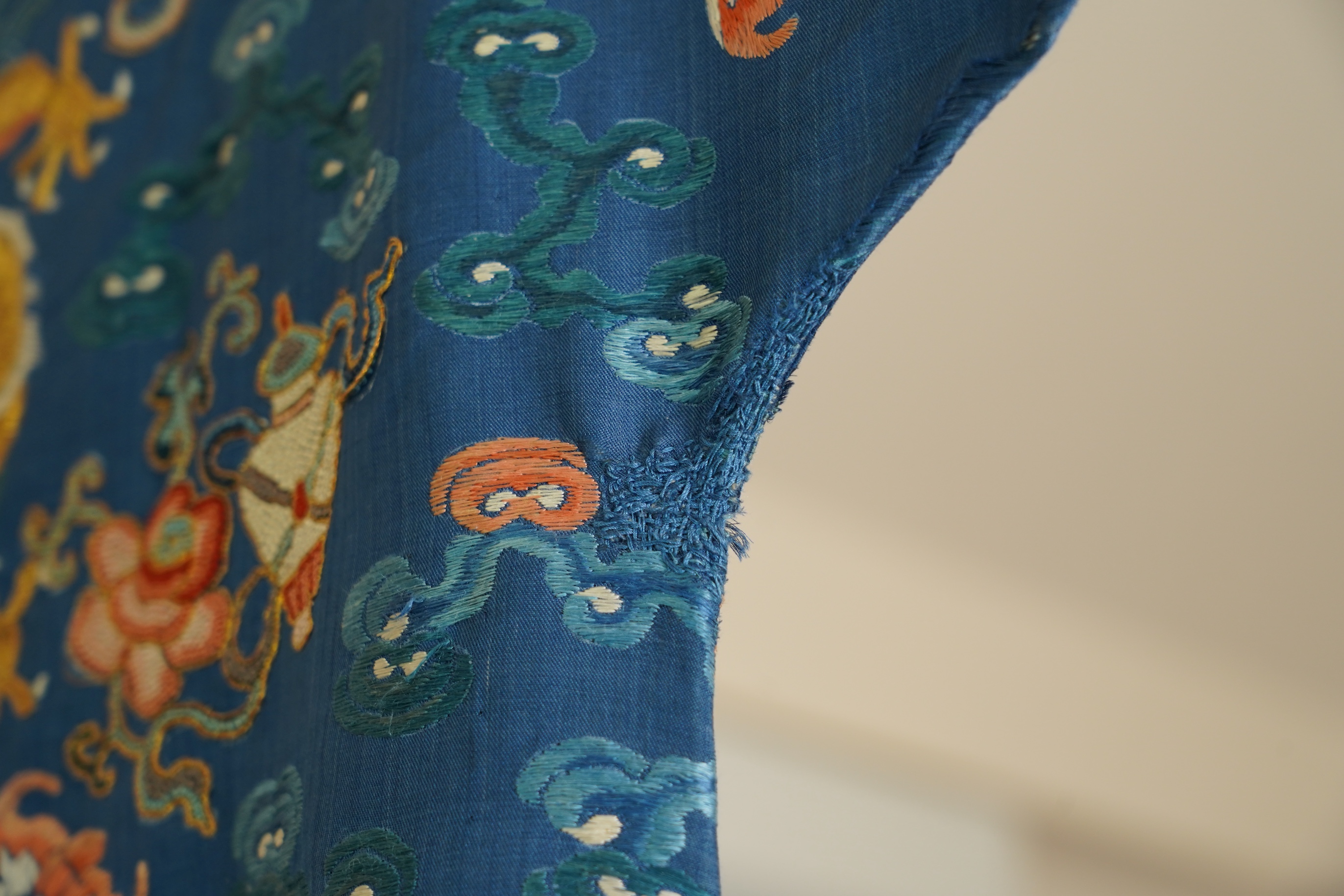 A Chinese blue silk man’s dragon robe, jifu, 19th century